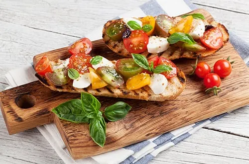 Bruschetta with tomatoes mozzarella and basil P7H8LM8