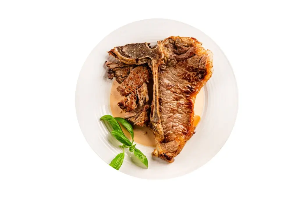 Delicious t bone steak on a white plate 2026 03 20 04 25 02 utc groot